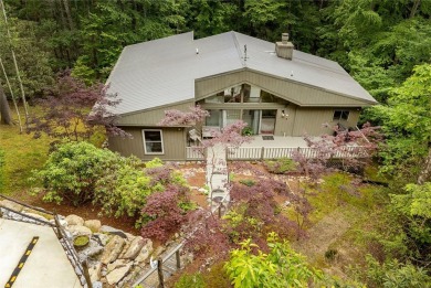 Discover a captivating retreat in Holly Forest with this classic on Sapphire National Golf Club in North Carolina - for sale on GolfHomes.com, golf home, golf lot
