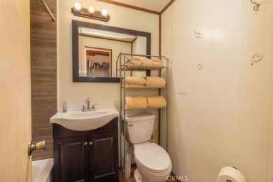 Enveloped by a quiet grove of mature pines and backing to a on Big Bear Mountain Ski and Golf Resort in California - for sale on GolfHomes.com, golf home, golf lot
