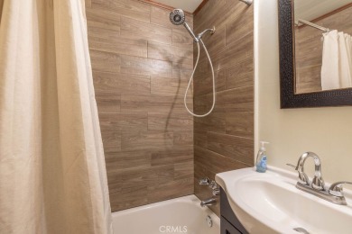 Enveloped by a quiet grove of mature pines and backing to a on Big Bear Mountain Ski and Golf Resort in California - for sale on GolfHomes.com, golf home, golf lot