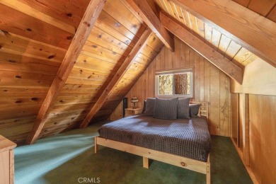 Enveloped by a quiet grove of mature pines and backing to a on Big Bear Mountain Ski and Golf Resort in California - for sale on GolfHomes.com, golf home, golf lot