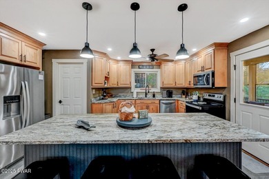 Stunning Roamingwood Lakefront Retreat in The Hideout - Fully on The Hideout Golf in Pennsylvania - for sale on GolfHomes.com, golf home, golf lot