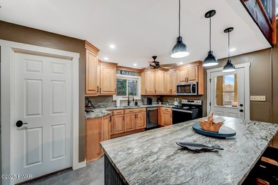 Stunning Roamingwood Lakefront Retreat in The Hideout - Fully on The Hideout Golf in Pennsylvania - for sale on GolfHomes.com, golf home, golf lot