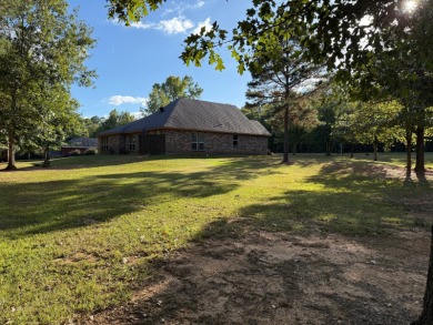 Nestled in a highly sought-after area just minutes from Cypress on Cypress Bend Golf Resort in Louisiana - for sale on GolfHomes.com, golf home, golf lot