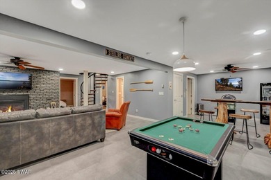 Stunning Roamingwood Lakefront Retreat in The Hideout - Fully on The Hideout Golf in Pennsylvania - for sale on GolfHomes.com, golf home, golf lot