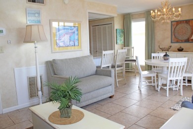 Charming 1-Bedroom Condo with Golf Course & Canal Views in on Sandpiper Cove Golf Course in Florida - for sale on GolfHomes.com, golf home, golf lot