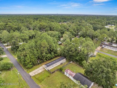 Charming 3-bedroom, 2-bath home nestled in the heart of Gautier on Mississippi National Golf Course in Mississippi - for sale on GolfHomes.com, golf home, golf lot