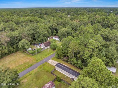 Charming 3-bedroom, 2-bath home nestled in the heart of Gautier on Mississippi National Golf Course in Mississippi - for sale on GolfHomes.com, golf home, golf lot