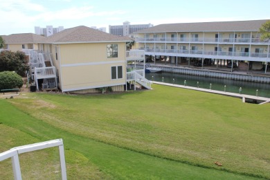 Charming 1-Bedroom Condo with Golf Course & Canal Views in on Sandpiper Cove Golf Course in Florida - for sale on GolfHomes.com, golf home, golf lot