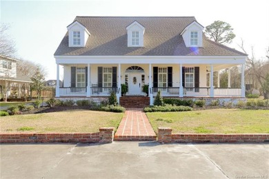 Welcome to this exquisite traditional home boasting luxurious on Lake Charles Country Club in Louisiana - for sale on GolfHomes.com, golf home, golf lot