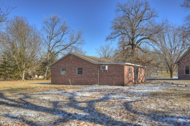 Luxury home located off the #3 tee box in Baxter Springs, KS on Baxter Country Club in Kansas - for sale on GolfHomes.com, golf home, golf lot