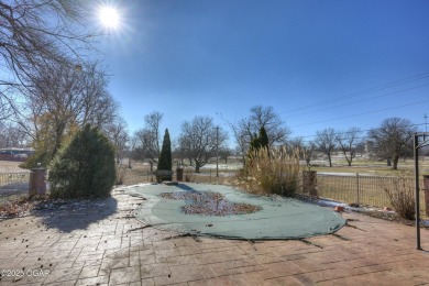 Luxury home located off the #3 tee box in Baxter Springs, KS on Baxter Country Club in Kansas - for sale on GolfHomes.com, golf home, golf lot