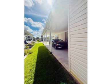 AMAZING CORNER LOT FEATURING A 3-BEDROOM, 2-BATHROOM HOME WITH on Cypress Greens in Florida - for sale on GolfHomes.com, golf home, golf lot