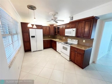 NESTLED IN ONE OF PALM AIRE COUNTRY CLUB'S MOST DESIRABLE on Palm-Aire Country Club and Resort - The Oaks in Florida - for sale on GolfHomes.com, golf home, golf lot