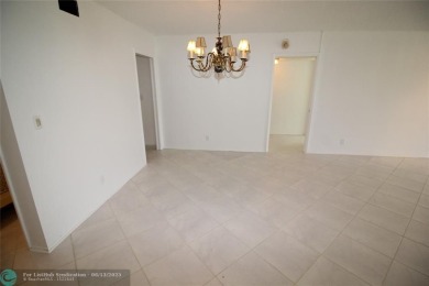 NESTLED IN ONE OF PALM AIRE COUNTRY CLUB'S MOST DESIRABLE on Palm-Aire Country Club and Resort - The Oaks in Florida - for sale on GolfHomes.com, golf home, golf lot