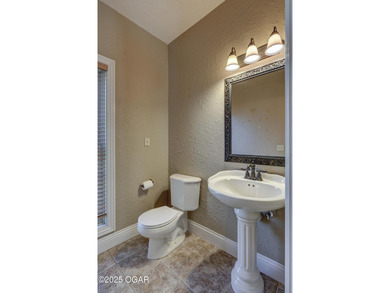 Luxury home located off the #3 tee box in Baxter Springs, KS on Baxter Country Club in Kansas - for sale on GolfHomes.com, golf home, golf lot