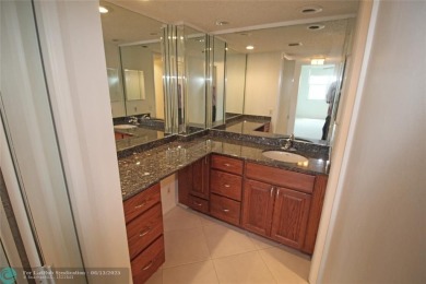 NESTLED IN ONE OF PALM AIRE COUNTRY CLUB'S MOST DESIRABLE on Palm-Aire Country Club and Resort - The Oaks in Florida - for sale on GolfHomes.com, golf home, golf lot
