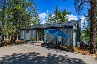 Perched on a serene hillside in Munds Park and bordered by on Pinewood Country Club in Arizona - for sale on GolfHomes.com, golf home, golf lot