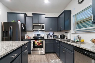 Set in a desirable golf course neighborhood, this stylish on St. Andrews Golf and Country Club in Georgia - for sale on GolfHomes.com, golf home, golf lot