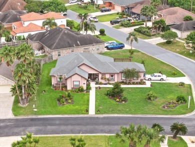 This exquisite custom-built home, located on a breezy corner lot on South Padre Island Golf Club in Texas - for sale on GolfHomes.com, golf home, golf lot