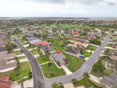 This exquisite custom-built home, located on a breezy corner lot on South Padre Island Golf Club in Texas - for sale on GolfHomes.com, golf home, golf lot