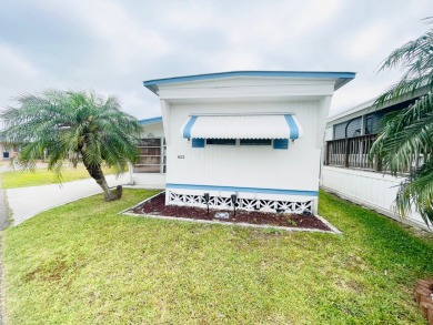 This home is located in a 55+ community in the back of the park on Lone Palm Golf Club in Florida - for sale on GolfHomes.com, golf home, golf lot