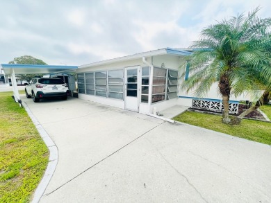 This home is located in a 55+ community in the back of the park on Lone Palm Golf Club in Florida - for sale on GolfHomes.com, golf home, golf lot