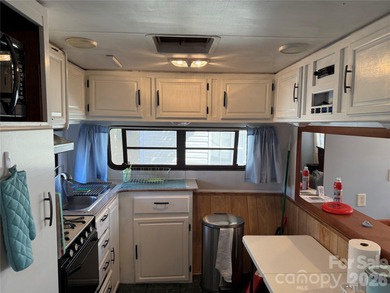 Cute, spacious 2 bedroom, 1 bath unit with lots of sleeping on The Tillery Tradition Country Club in North Carolina - for sale on GolfHomes.com, golf home, golf lot