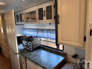 Cute, spacious 2 bedroom, 1 bath unit with lots of sleeping on The Tillery Tradition Country Club in North Carolina - for sale on GolfHomes.com, golf home, golf lot