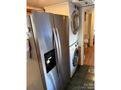 Cute, spacious 2 bedroom, 1 bath unit with lots of sleeping on The Tillery Tradition Country Club in North Carolina - for sale on GolfHomes.com, golf home, golf lot