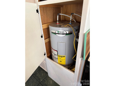 Cute, spacious 2 bedroom, 1 bath unit with lots of sleeping on The Tillery Tradition Country Club in North Carolina - for sale on GolfHomes.com, golf home, golf lot