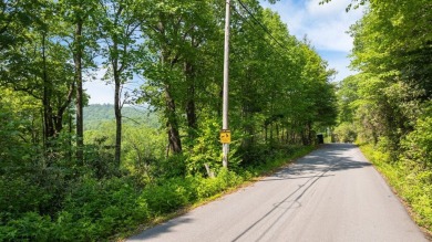 Just a few minutes from Main Street Highlands, you'll find this on Highlands Falls Country Club in North Carolina - for sale on GolfHomes.com, golf home, golf lot
