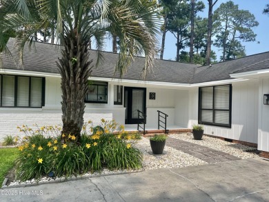 This delightful residence seamlessly blends style and comfort on Carolina Shores Golf Course in North Carolina - for sale on GolfHomes.com, golf home, golf lot