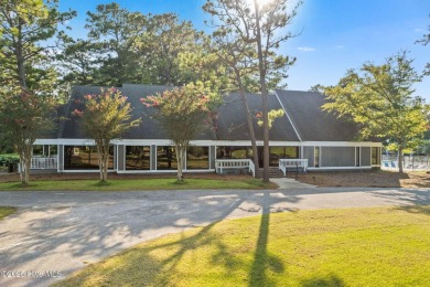 This delightful residence seamlessly blends style and comfort on Carolina Shores Golf Course in North Carolina - for sale on GolfHomes.com, golf home, golf lot