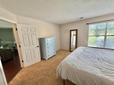 Beautiful first-floor villa featuring a private deck with serene on Old South Golf Links in South Carolina - for sale on GolfHomes.com, golf home, golf lot