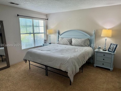 Beautiful first-floor villa featuring a private deck with serene on Old South Golf Links in South Carolina - for sale on GolfHomes.com, golf home, golf lot