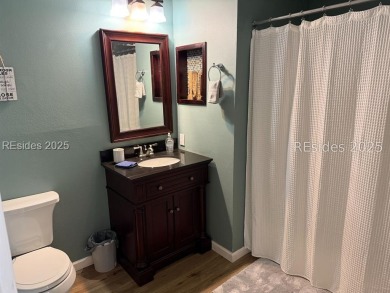 Beautiful first-floor villa featuring a private deck with serene on Old South Golf Links in South Carolina - for sale on GolfHomes.com, golf home, golf lot