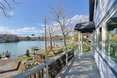 Experience lakefront living at its finest with this exquisite on Osiris Country Club in New York - for sale on GolfHomes.com, golf home, golf lot