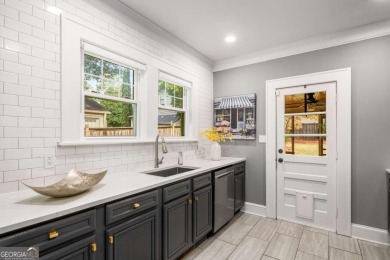 This 3-bedroom, 2-bath brick bungalow blends timeless character on College Park Municipal Golf Course in Georgia - for sale on GolfHomes.com, golf home, golf lot