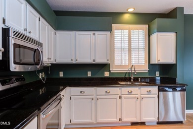 Brick-front home overlooking the 18th tee at Hedingham Golf Club on Hedingham Golf and Athletic Club in North Carolina - for sale on GolfHomes.com, golf home, golf lot