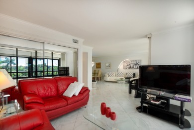 Beautifully renovated corner residence combining the comfort of on The Country Club At Boca Raton in Florida - for sale on GolfHomes.com, golf home, golf lot