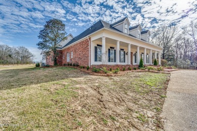 Welcome to this elegant 6-bedroom, 4.5-bathroom home with a on Colonial Country Club Deerfield in Mississippi - for sale on GolfHomes.com, golf home, golf lot