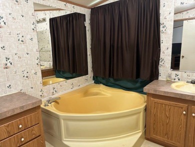 Location! Location! This Waterview 3B/2B MH is walk in ready & on Cypress Bend Golf Course in Texas - for sale on GolfHomes.com, golf home, golf lot