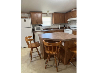 Location! Location! This Waterview 3B/2B MH is walk in ready & on Cypress Bend Golf Course in Texas - for sale on GolfHomes.com, golf home, golf lot