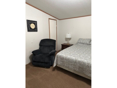 Location! Location! This Waterview 3B/2B MH is walk in ready & on Cypress Bend Golf Course in Texas - for sale on GolfHomes.com, golf home, golf lot