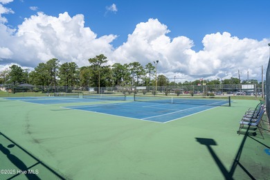 Offered for sale is a flat, well-draining wooded home site on Olde Point Golf and Country Club in North Carolina - for sale on GolfHomes.com, golf home, golf lot