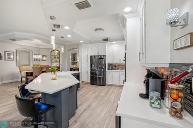 Welcome to your beautifully remodeled, one-level townhome! This on Parkland Golf Club in Florida - for sale on GolfHomes.com, golf home, golf lot