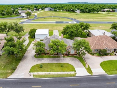 RUNWAY LIVING AT ITS FINEST!  Live where you fly in this on Pecan Plantation Country Club in Texas - for sale on GolfHomes.com, golf home, golf lot