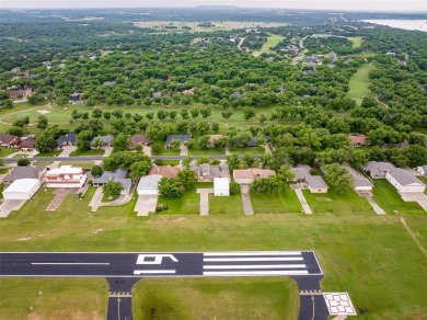 RUNWAY LIVING AT ITS FINEST!  Live where you fly in this on Pecan Plantation Country Club in Texas - for sale on GolfHomes.com, golf home, golf lot