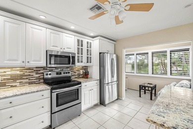 Spacious 3-bedroom, 2-bath condo featuring wood-look tile on Quail Ridge Golf Course and Country Club in Florida - for sale on GolfHomes.com, golf home, golf lot
