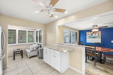 Spacious 3-bedroom, 2-bath condo featuring wood-look tile on Quail Ridge Golf Course and Country Club in Florida - for sale on GolfHomes.com, golf home, golf lot